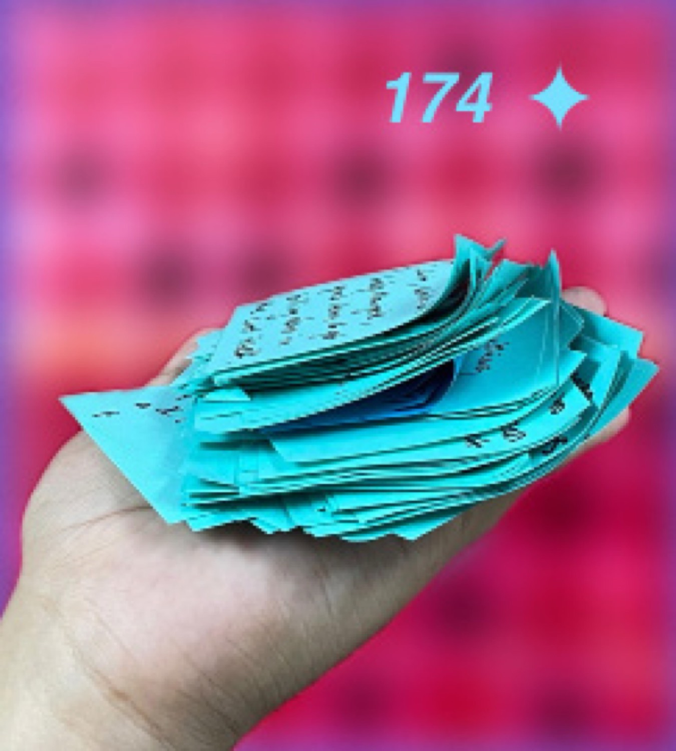 A hand holding the blue clusters created during affinitization